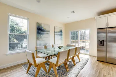 a dining room with a glass table and chairs at Walk to Keansburg Beach! Family Home with Pool in Keansburg