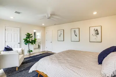 a bedroom with a bed and a couch at Walk to Keansburg Beach! Family Home with Pool in Keansburg
