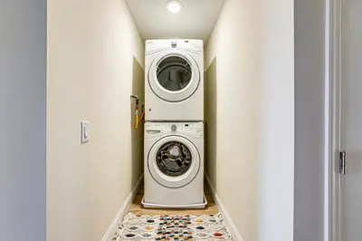 a laundry room with a washer and dryer at Walk to Keansburg Beach! Family Home with Pool in Keansburg