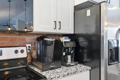 a kitchen with a coffee maker on a counter at The Rock Oak Escape in Dingmans Ferry