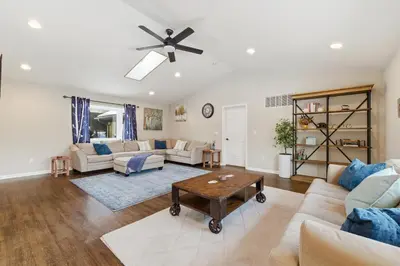 a living room with a couch and a ceiling fan at The Rock Oak Escape in Dingmans Ferry