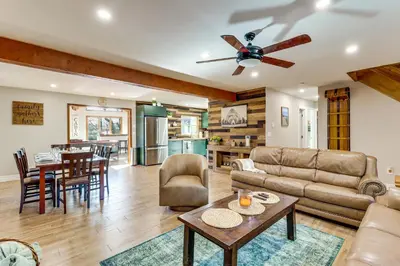 a living room with a couch and a table at 5 Mi to Jack Frost Skiing Walkable Family Home in Lake Harmony