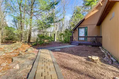 a home with a driveway leading to a house at 5 Mi to Jack Frost Skiing Walkable Family Home in Lake Harmony