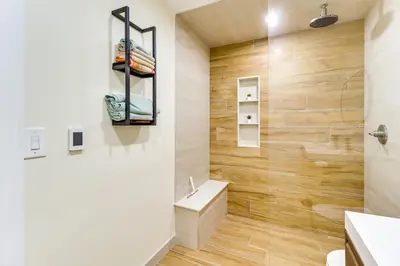 a bathroom with wooden walls and a sink at 5 Mi to Jack Frost Skiing Walkable Family Home in Lake Harmony