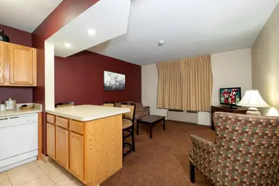 a kitchen and living room in a hotel room at Red Roof Inn & Suites Hazleton in Hazleton