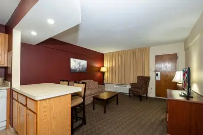a living room with a kitchen and a living room at Red Roof Inn & Suites Hazleton in Hazleton