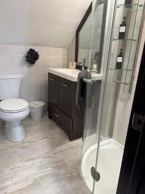 a bathroom with a toilet and a sink and a shower at Mountain View family escape in Albrightsville