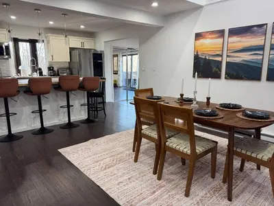 a kitchen and dining room with a table and chairs at Mountain View family escape in Albrightsville