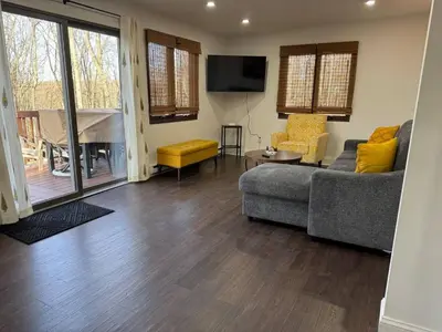 a living room with a couch and a television at Mountain View family escape in Albrightsville