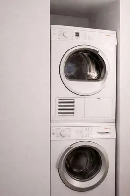 a washing machine and a dryer in a room at Hip NYC Hideaway in Lively East Village in New York