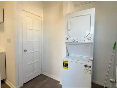 a white refrigerator with a mirror on top of it at 3 Loft Bedrooms Gazebo Patio Lounge in Roselle