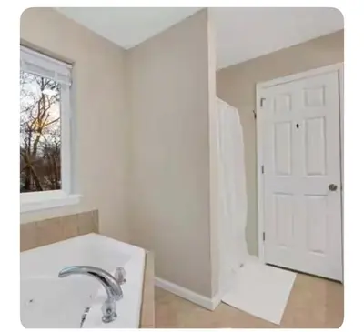 a bathroom with a sink and a white door at Boulders Retreat Hot Tub Sauna Game Room Fire Pit in Tobyhanna
