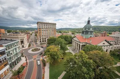 an aerial view of a city with a clock tower at Pleasant, Comfortable PR Near Vestal NY in Johnson City