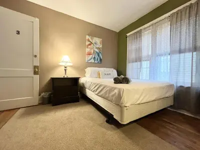 a bedroom with a bed and a window at Binghamton Hospitals Private Room Shared Spaces Trades Medical Staff Welcom in Binghamton