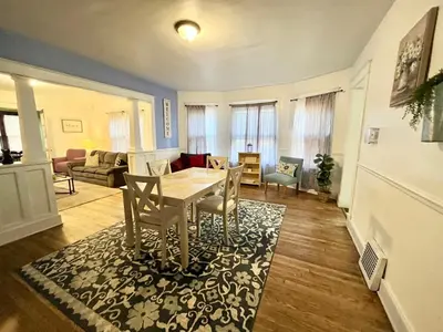 a living room with a table and chairs at Binghamton Hospitals Private Room Shared Spaces Trades Medical Staff Welcom in Binghamton
