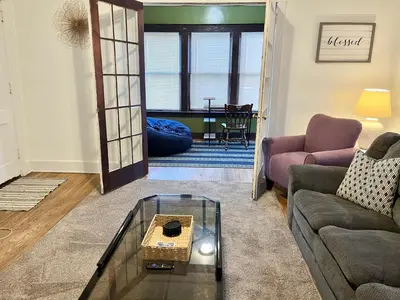 a living room with a couch and a table at NightShiftReady Binghamton Trades Nurses Welcome Private Room in Shared Apartment in Binghamton
