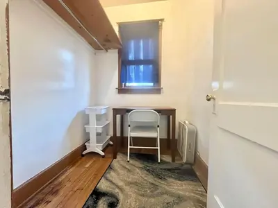 a small desk in a room with a window at Affordable for Crews Binghamton Close to Job Sites in Binghamton