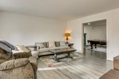 a living room with two couches and a pool table at Hike, Ski and Game Spacious Poconos Home with Yard in Tobyhanna