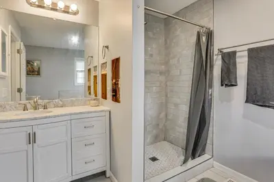 a bathroom with a shower and a sink at Hike, Ski and Game Spacious Poconos Home with Yard in Tobyhanna