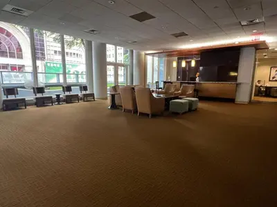 a large room with a table and chairs in a building at 1600 Broadway in New York