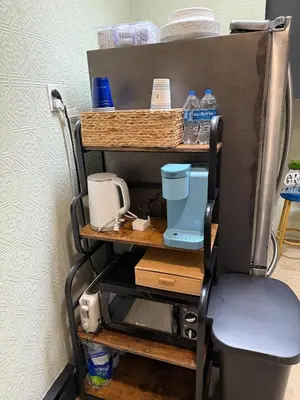 a cart with bottles of water on top of it at Happy House in the City in Harrisburg