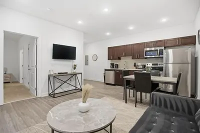 a living room with a couch and a table at Modern 1BR1BA unit at Fairmount Square in Philadelphia