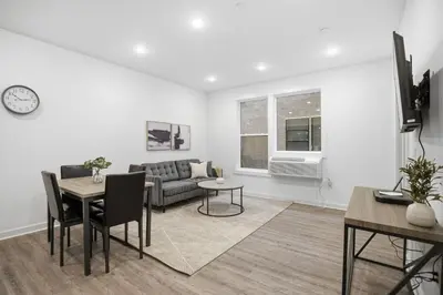 a living room with a couch and a table at Modern 1BR1BA unit at Fairmount Square in Philadelphia