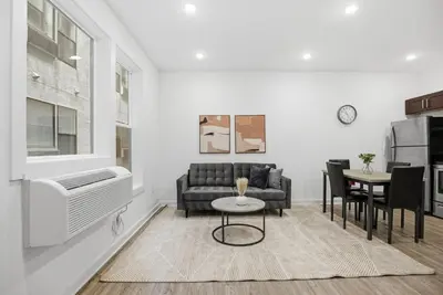 a living room with a couch and a table at Contemporary 1BR inside Fairmount Square in Philadelphia
