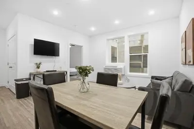a living room with a table and a couch at Contemporary 1BR inside Fairmount Square in Philadelphia