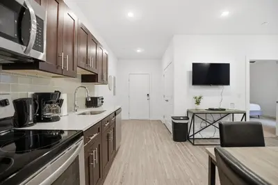 a kitchen with a sink and a counter top at Contemporary 1BR inside Fairmount Square in Philadelphia