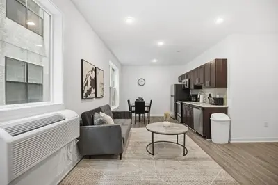 a living room with a couch and a table at Refreshed 1BR1BA in Fairmount Square in Philadelphia