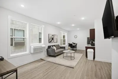 a living room with a couch and a table at Refreshed 1BR1BA in Fairmount Square in Philadelphia
