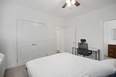 a bedroom with a bed and a desk and a chair at Refreshed 1BR1BA in Fairmount Square in Philadelphia