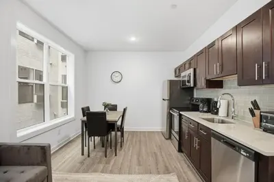 a kitchen with a table and a dining room at Refreshed 1BR1BA in Fairmount Square in Philadelphia