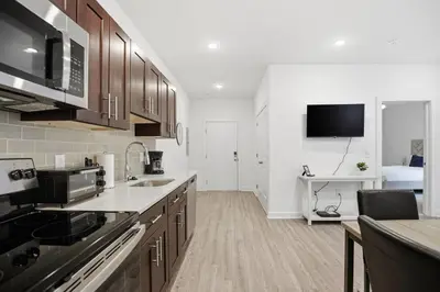 a kitchen with a sink and a counter top at Cozy and bright 1BR located in Fairmount Square in Philadelphia