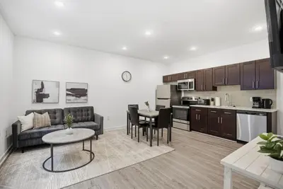 a living room with a couch and a table at Cozy and bright 1BR located in Fairmount Square in Philadelphia
