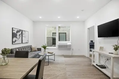 a living room with a couch and a table at Attractive 1BR1BA apartment at Fairmount Square in Philadelphia