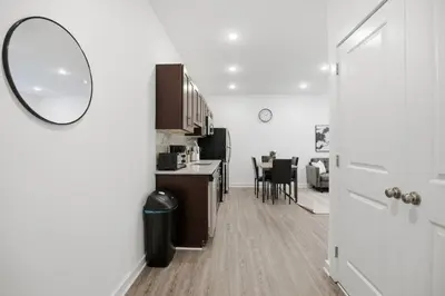a kitchen and dining room with a mirror on the door at Attractive 1BR1BA apartment at Fairmount Square in Philadelphia