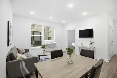 a living room with a table and a couch at Attractive 1BR1BA apartment at Fairmount Square in Philadelphia