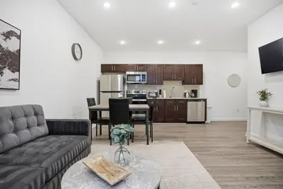 a living room with a couch and a table at Bright and cozy 1BR inside Fairmount Square in Philadelphia
