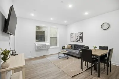 a living room with a couch and a table at Bright and cozy 1BR inside Fairmount Square in Philadelphia
