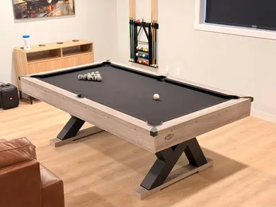 a pool table in a living room with afits at Huge Private Suite with Pool Table, Sauna & Fire Pit in Ellenville