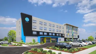 a rendering of a building with cars parked outside at Tru By Hilton Hazleton in Hazleton