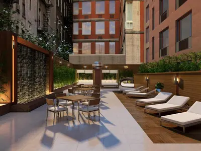 a patio with tables and chairs in a building at Cameo in New York
