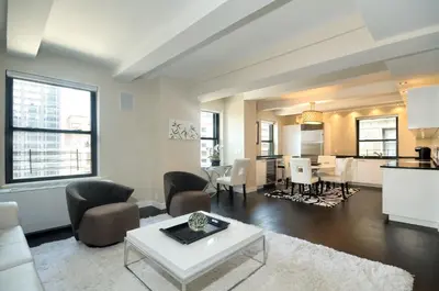 a living room with a couch and a table at Executive Plaza in New York
