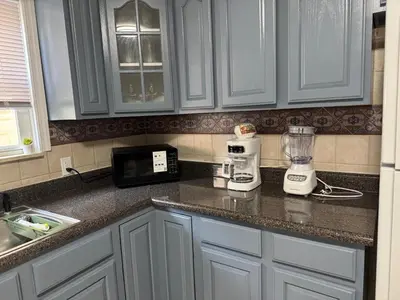 a kitchen counter with a blender on top of it at Lovely 2Bed in Newark in Newark
