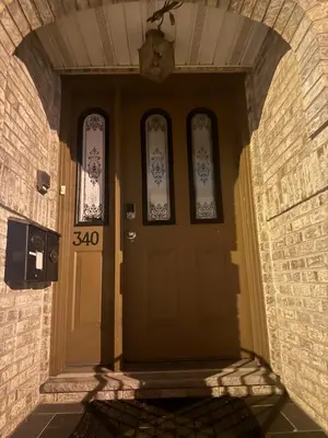 an entrance to a building with a yellow door at Lovely 2Bed in Newark in Newark