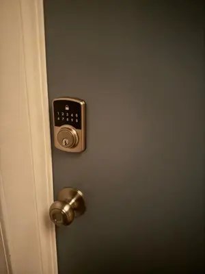 a door with a knob and a lock on it at Lovely 2Bed in Newark in Newark