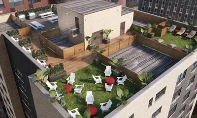 an overhead view of a building with a courtyard with tables and chairs at Nash in New York