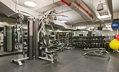 a gym with lots of equipment and balloons in it at Nash in New York